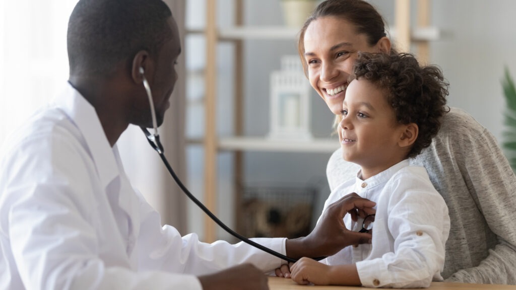 African Male Pediatrician Hold Stethoscope Exam Child Boy Patient Visit Doctor with Mother